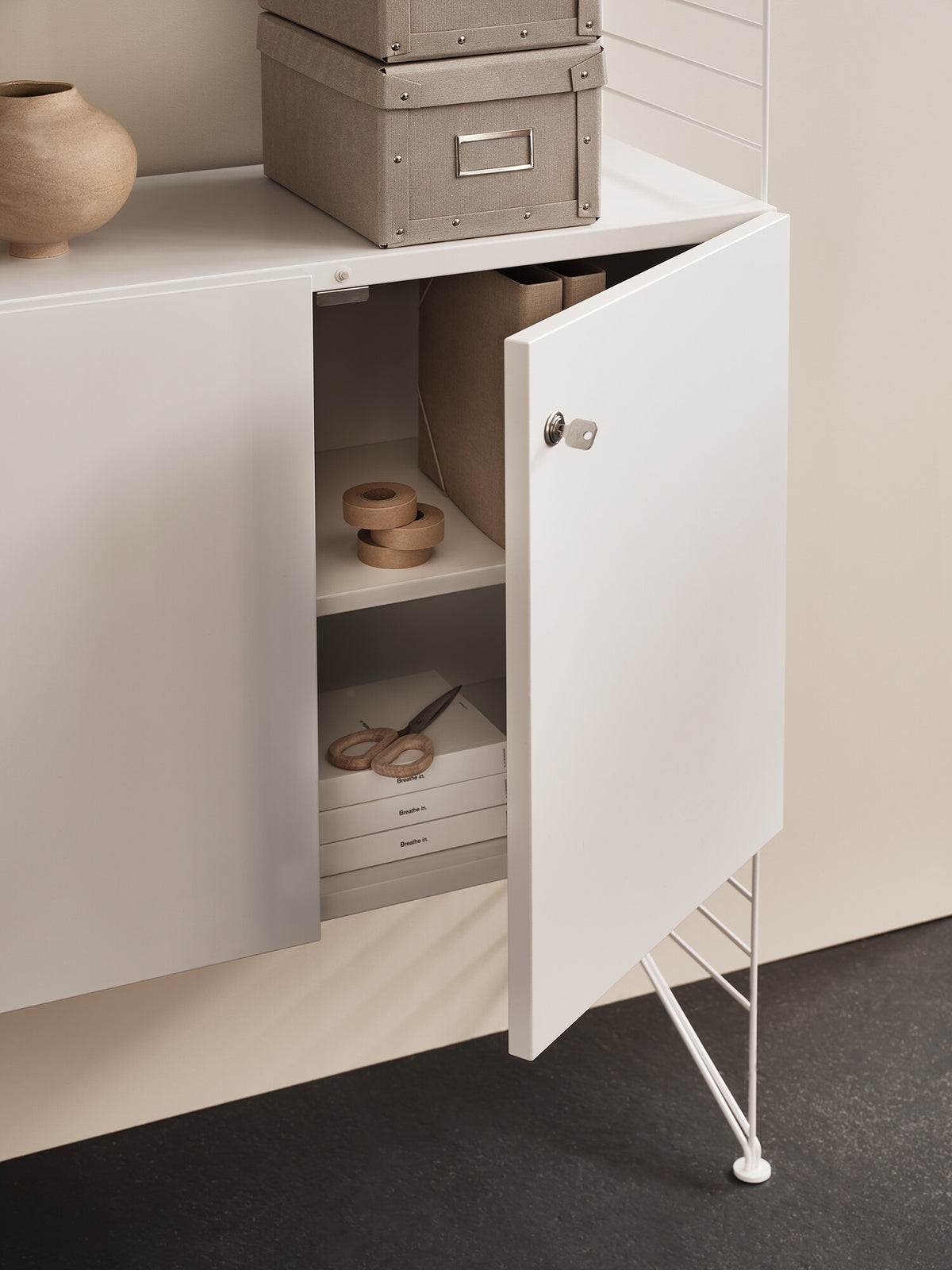 Cabinet with lock w78 x d32 x h52 cm in White, room setting
