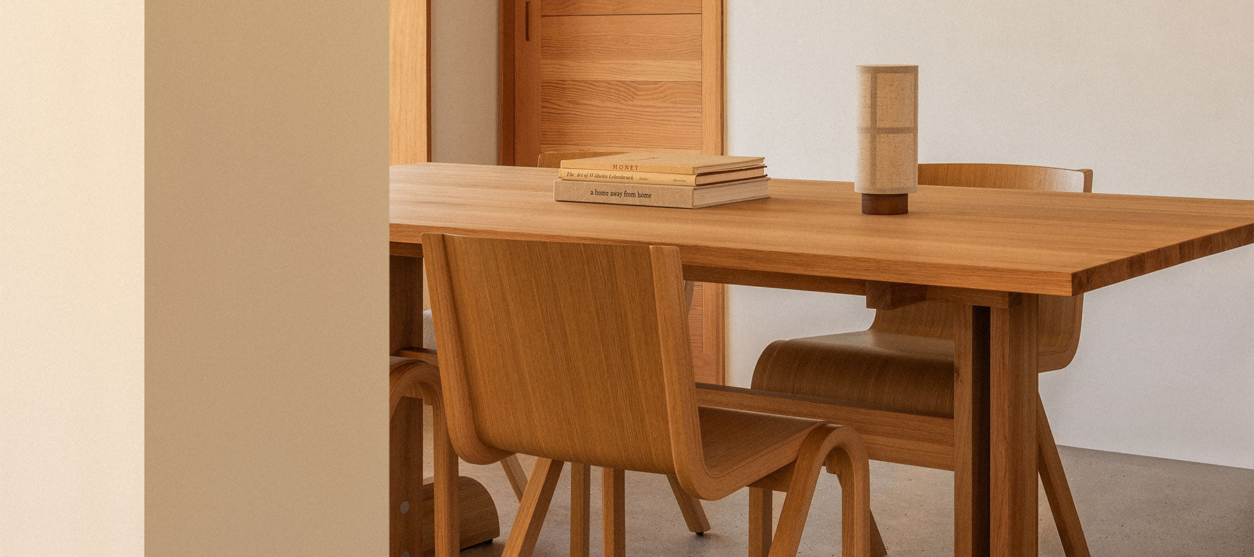 Audo dining furniture and lighting in an architectural interior